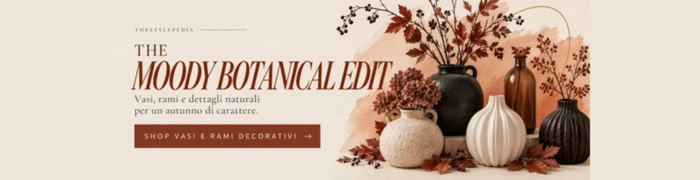 Vasi decorativi in ceramica e rami autunnali bordeaux e ruggine per un allestimento Halloween raffinato e naturale.
